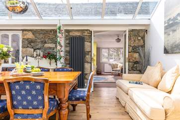 The sitting-room leads to the conservatory.