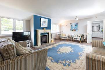 The light and airy sitting room is the perfect place to relax.