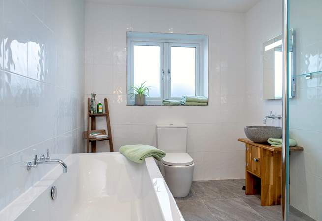The family bathroom has a double ended bath, perfect for a long holiday soak.