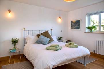 Bedroom 2 with its king-size bed.