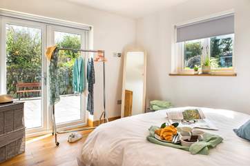 Patio doors lead out to the terrace from bedroom 1, ideal for enjoying a cuppa in the early morning sunshine.