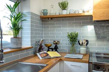 Cook up some culinary delights in the well-equipped kitchen.