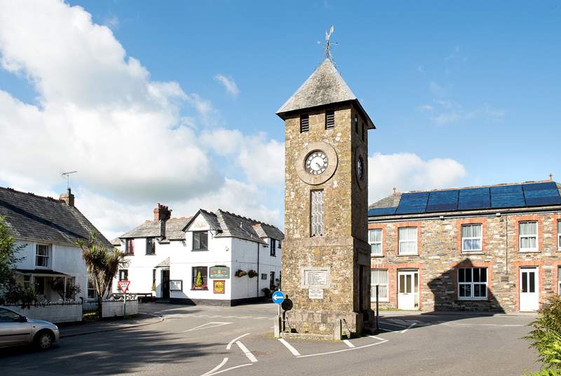 The famous clock tower in the centre of the village and the village pub.