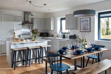 The kitchen has all that you need to create those feasts that you never find time for at home. The dining table seats eight.