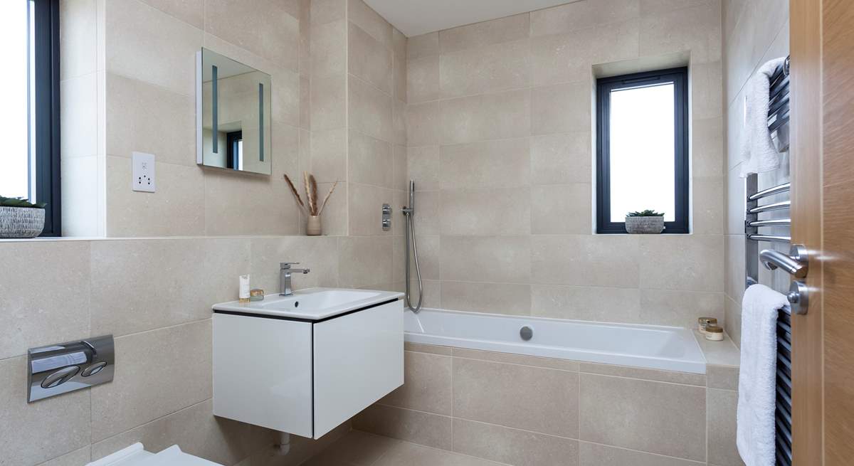 The lovely contemporary family bathroom is also located on the first floor.