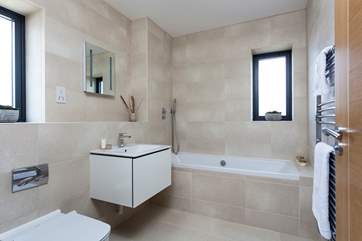 The lovely contemporary family bathroom is also located on the first floor.