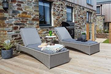 The sunny deck is the perfect spot for a pre dinner drink.