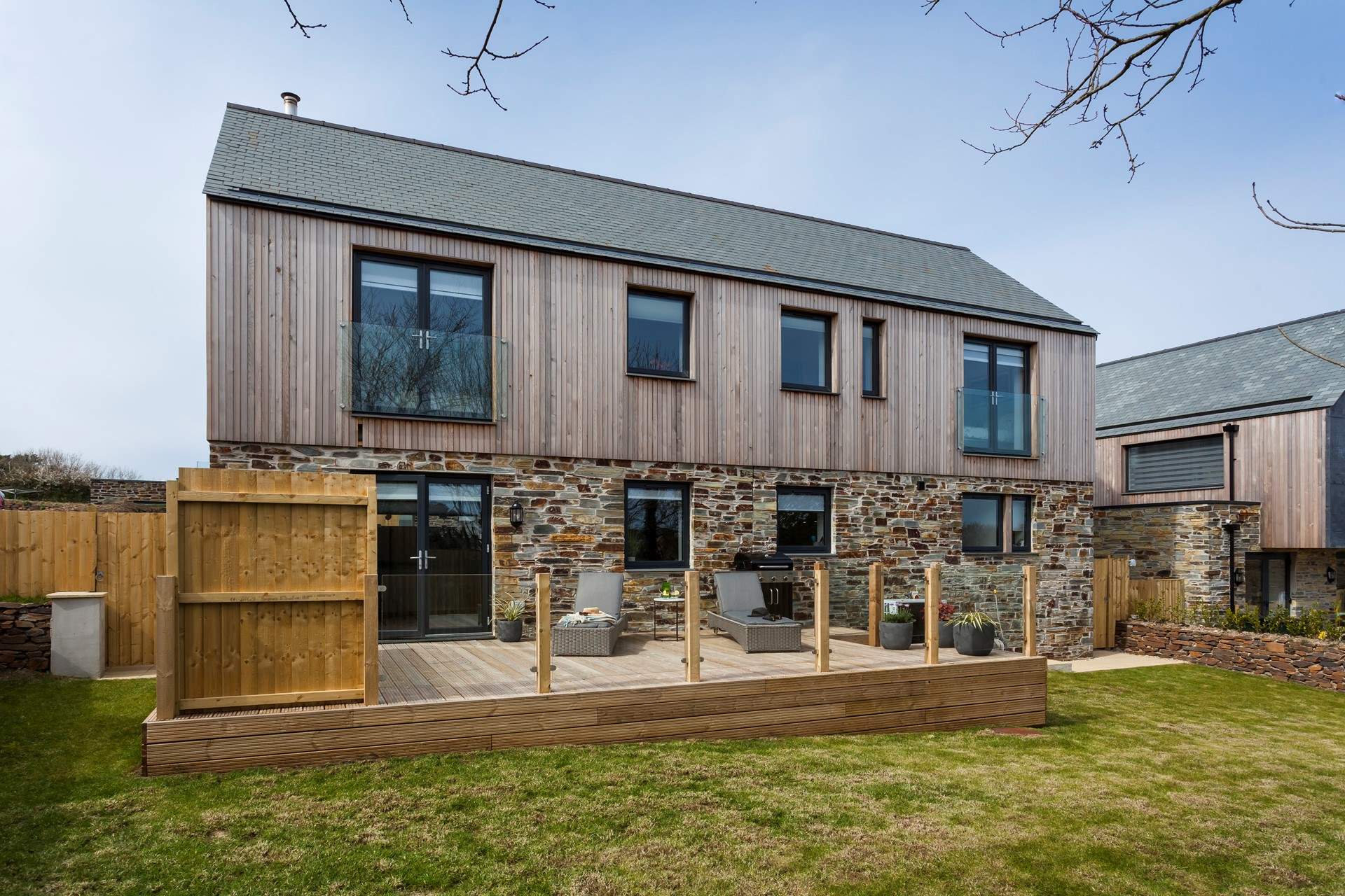 The simple gardens surround the rear of the house and offer plenty of space for cooking and dining outside (there’s a great barbecue for the outdoor chef). 