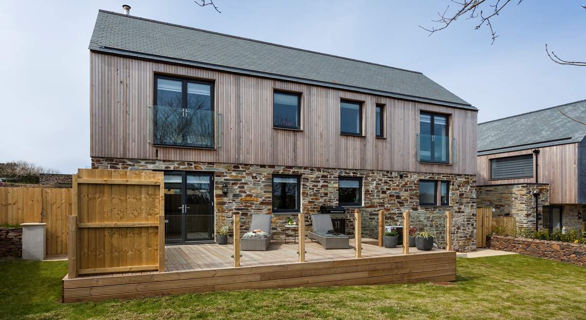 The simple gardens surround the rear of the house and offer plenty of space for cooking and dining outside (there’s a great barbecue for the outdoor chef). 