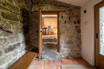 The entrance hall links the ground floor utility-room and shower-room and leads into the kitchen. It also provides a great spot for kicking off your boots in preparation to enjoy the main house.
