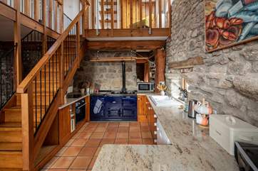 The spacious and well-equipped kitchen. Complemented by this beautiful Aga, perfect for that extra cosiness in the cooler months.