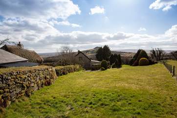 The view from the top of your garden, looking back over the cottage and out over Dartmoor.