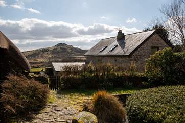 The gardens have magnificent views of Sharp Tor.