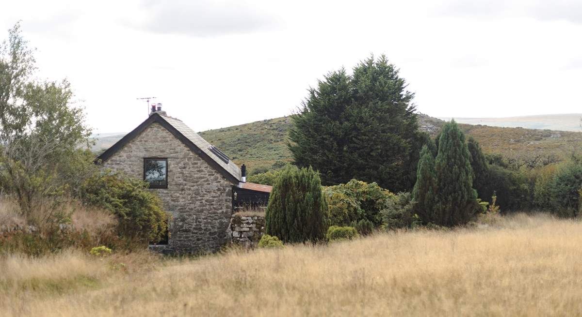 The view from the top of your garden, looking back over the cottage and out over Dartmoor.