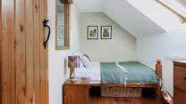 Bedroom 3 is perfect just for one. The slightly smaller double bed has standard width, just the length is slightly shorter to fit into this charming space.