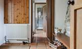 The entrance hall links the ground floor utility-room and shower-room and leads into the kitchen. It also provides a great spot for kicking off your boots in preparation to enjoy the main house. - Thumbnail Image