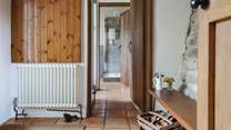 The entrance hall links the ground floor utility-room and shower-room and leads into the kitchen. It also provides a great spot for kicking off your boots in preparation to enjoy the main house.