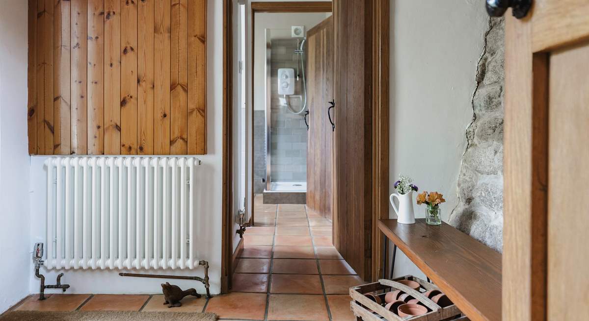 The entrance hall links the ground floor utility-room and shower-room and leads into the kitchen. It also provides a great spot for kicking off your boots in preparation to enjoy the main house.