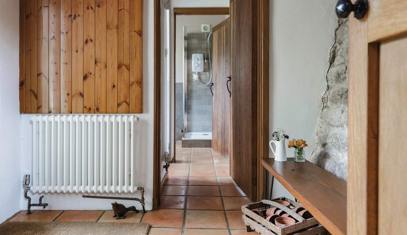 The entrance hall links the ground floor utility-room and shower-room and leads into the kitchen. It also provides a great spot for kicking off your boots in preparation to enjoy the main house.