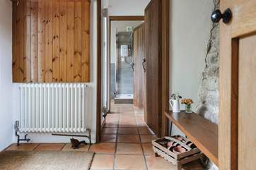 The entrance hall links the ground floor utility-room and shower-room and leads into the kitchen. It also provides a great spot for kicking off your boots in preparation to enjoy the main house.