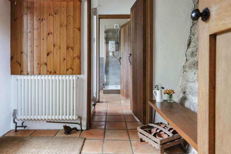 The entrance hall links the ground floor utility-room and shower-room and leads into the kitchen. It also provides a great spot for kicking off your boots in preparation to enjoy the main house.