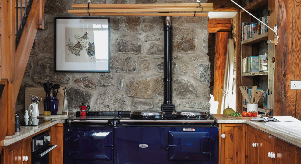 The spacious and well-equipped kitchen. Please note, the Aga is no longer in use but you have use of the brilliant induction hob and electric oven for cooking up your holiday meals.