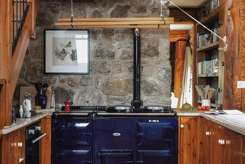 The spacious and well-equipped kitchen. Please note, the Aga is no longer in use but you have use of the brilliant induction hob and electric oven for cooking up your holiday meals.