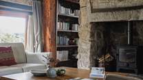 The sitting-room offers oodles of comfy seating and a generous sized coffee table.