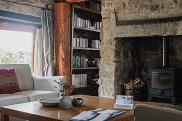 The sitting-room offers oodles of comfy seating and a generous sized coffee table.