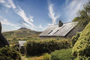 The gardens have magnificent views of Sharp Tor.