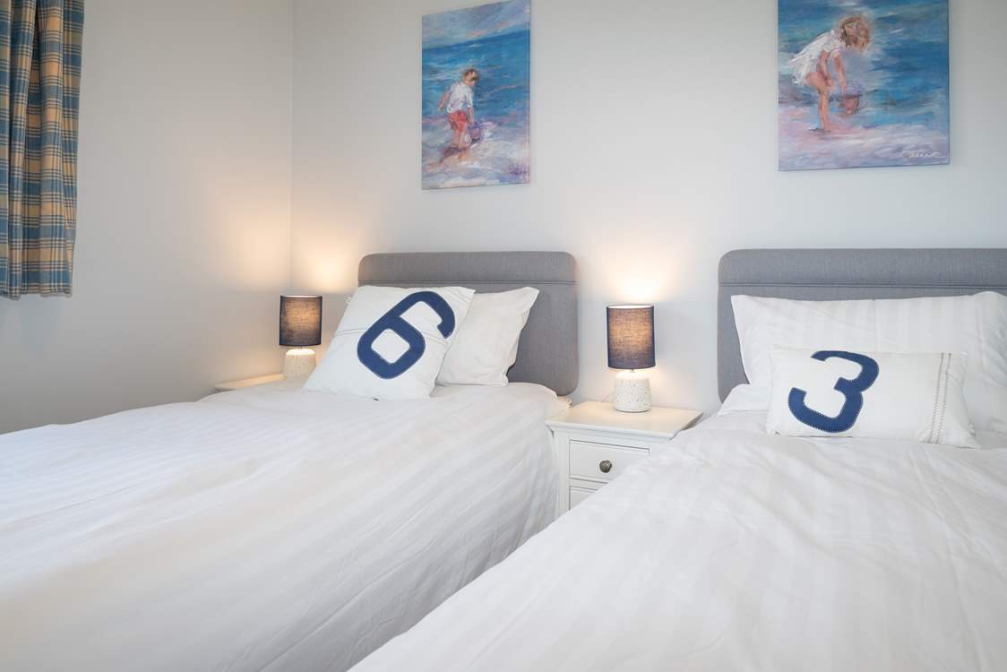 The twin bedroom on the first floor overlooks the garden.