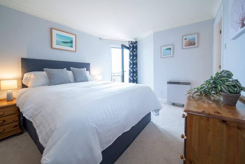 The spacious main bedroom on the first floor with en suite shower-room and balcony. 