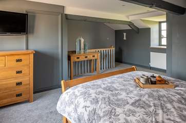 The bedroom is super spacious, light and airy.
