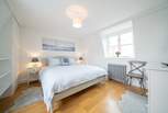 The light and spacious main bedroom on the first floor with sea views.