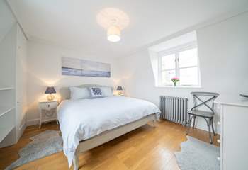 The light and spacious main bedroom on the first floor with sea views.