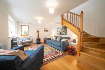 The cosy sitting-room on the ground floor with wood-burner.