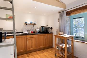 The kitchen is well-equipped for a meal for two.