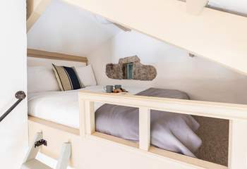 Your quirky double bed is tucked up the quaint ladder and overlooks your lovely open plan living space.