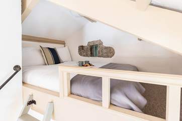 Your quirky double bed is tucked up the quaint ladder and overlooks your lovely open plan living space.
