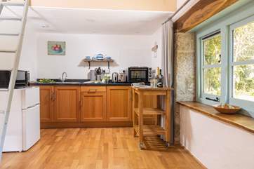 The kitchen is well-equipped for a meal for two.