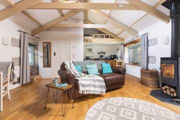 The living space is light and airy but super cosy in front of the wood-burner.