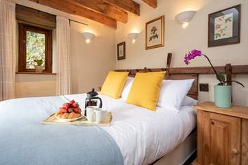 The bedroom is both bright and cheery.
