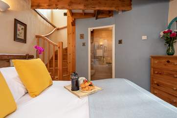The stairs lead from the bedroom and wind up into the first floor open plan living area.