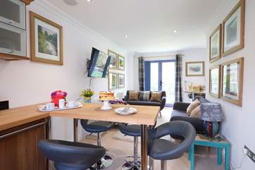 Eat at the breakfast-bar or in the dining-area by the French doors.