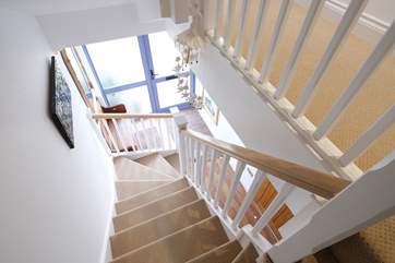 Stairs down to the front door entrance.
