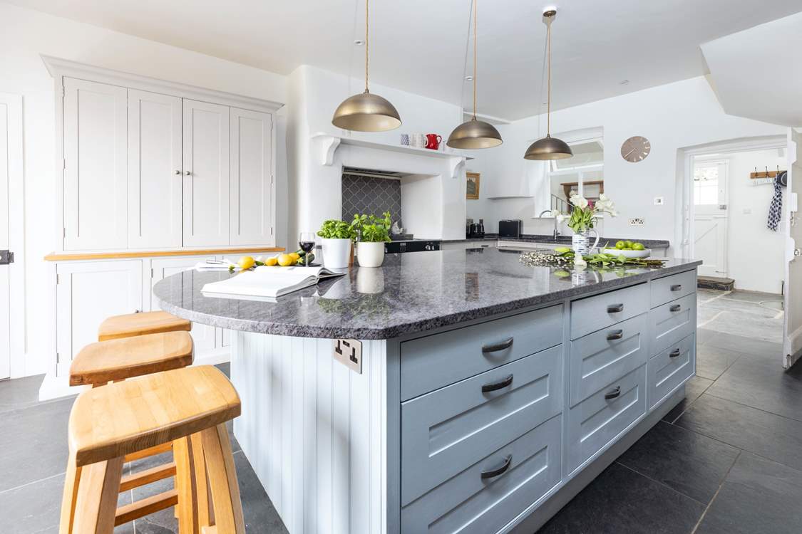 The kitchen offers a wonderful space to whip up a feast or enjoy a glass of something tasty together.