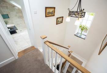 These beautiful stairs and a rather grand landing area link the ground floor and first floor.