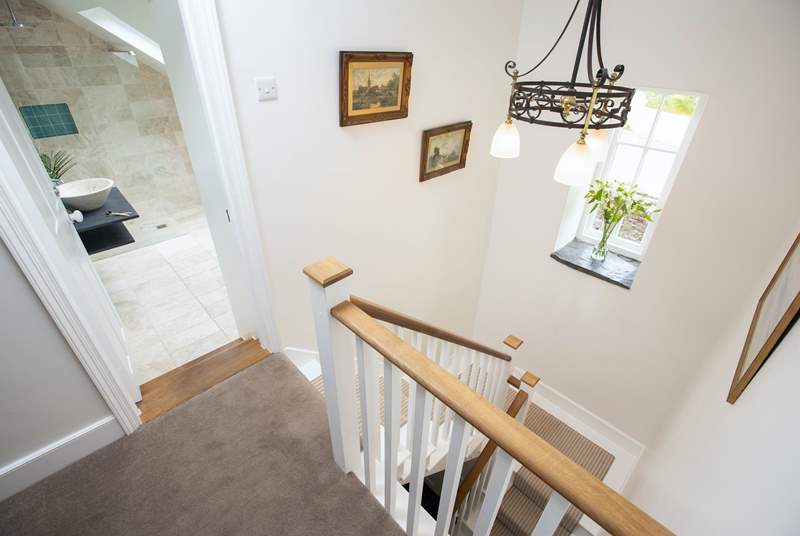 These beautiful stairs and a rather grand landing area link the ground floor and first floor.