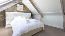 Bedroom 7 is exceptionally spacious and inviting.