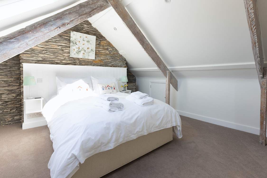 Bedroom 7 is exceptionally spacious and inviting.